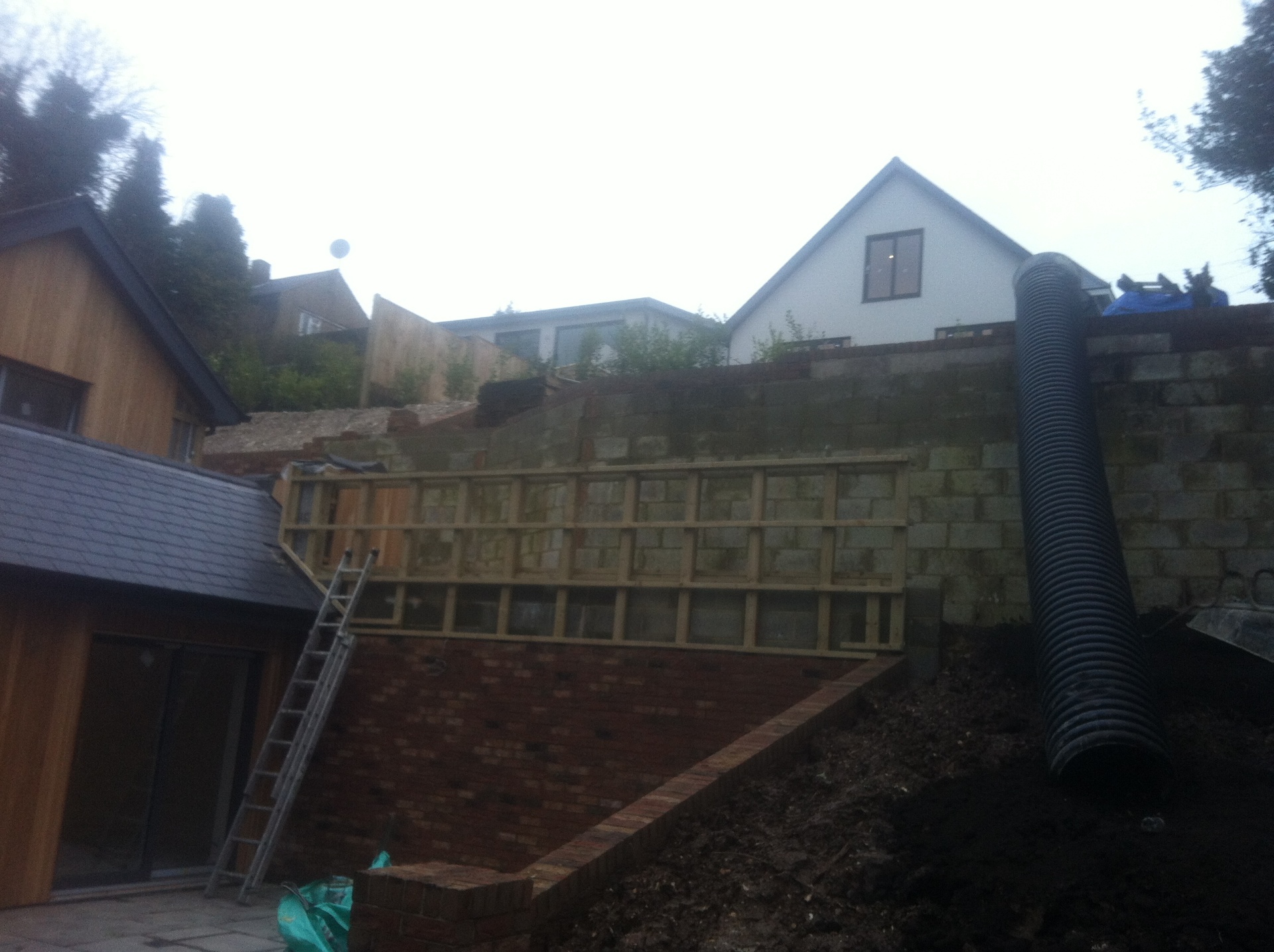 Timber decking with integrated seating area and garden room