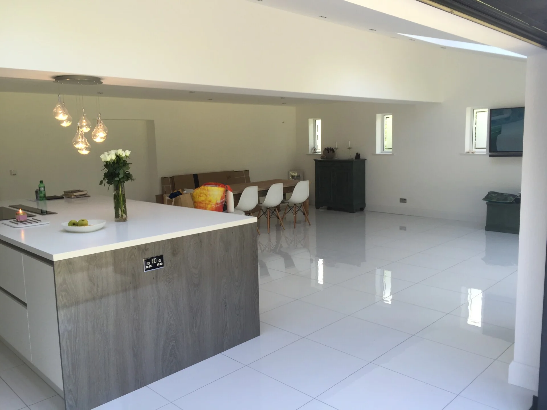 Completed open-plan kitchen-diner with structural steel beam support